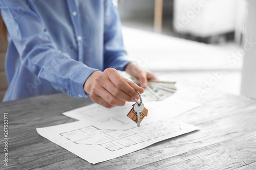 Real estate agent with key ...