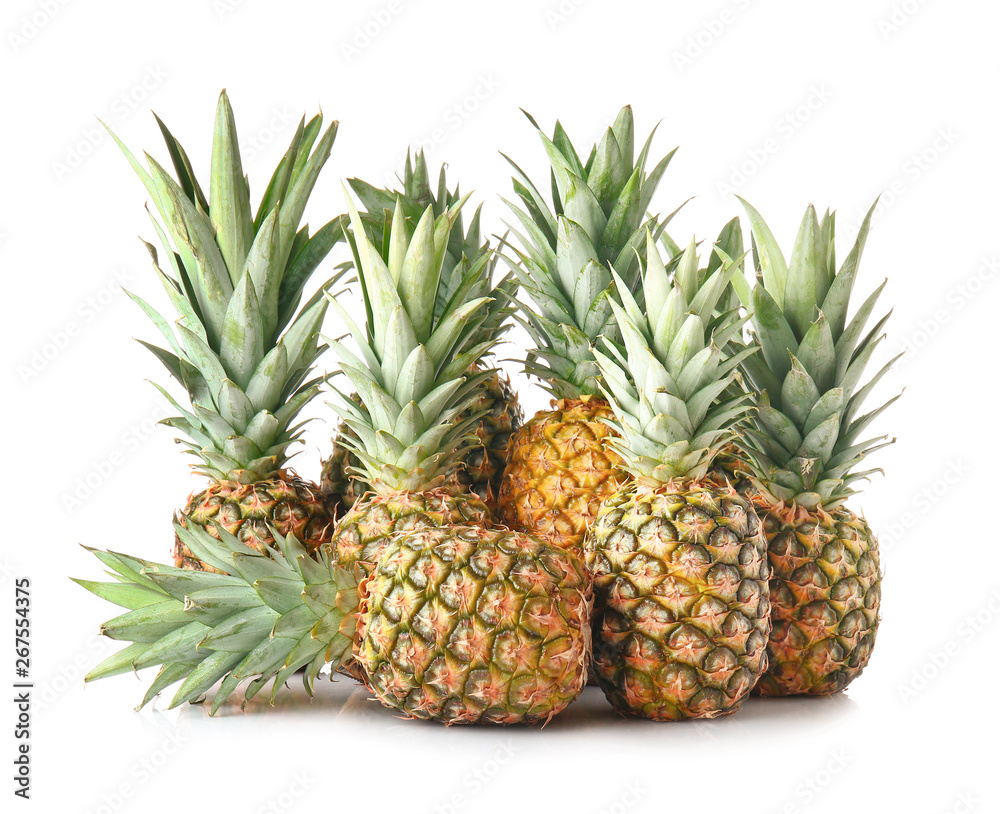 Fototapeta premium Ripe pineapples on white background