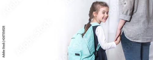 Parent and primary school student go hand in hand