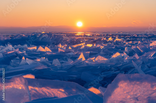Sunrise at Baikal frozen lake in winter season, Olkhon island, Siberia, Russia