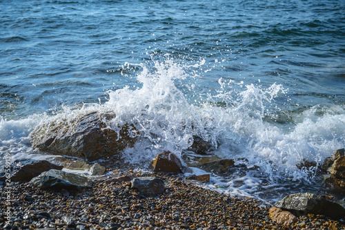 Waves at the seashore. Selective focus with shallow depth of field. photo