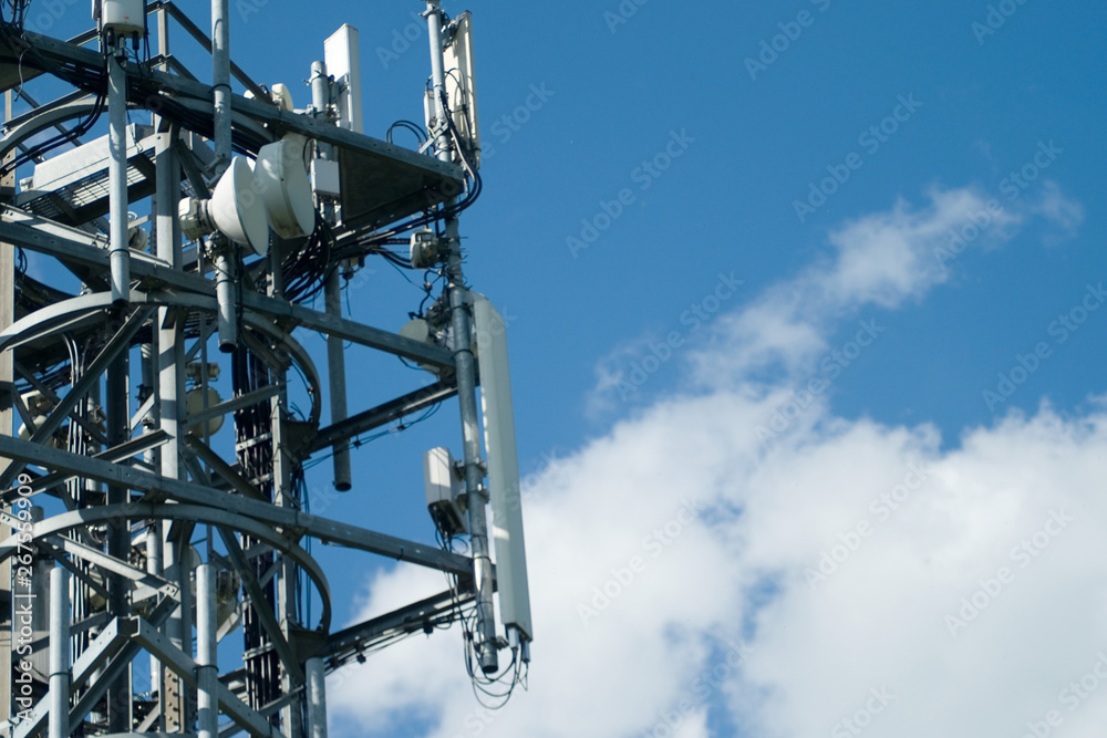 Communications tower with antenna against blue sky Communications tower with antenna against blue sky