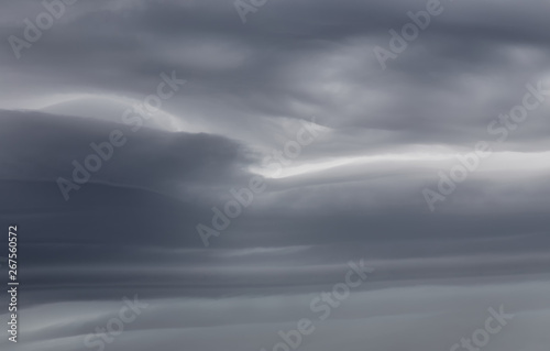Sky background with dramatic dark clouds. Sky texture photo with storm clouds