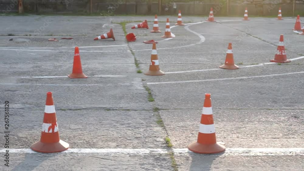 Traffic cones in driving school. Close up. Many traffic cones stand or lie on the road