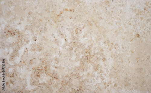 Abstract colorful smooth background from calcareous tufa beige hue with light inclusions