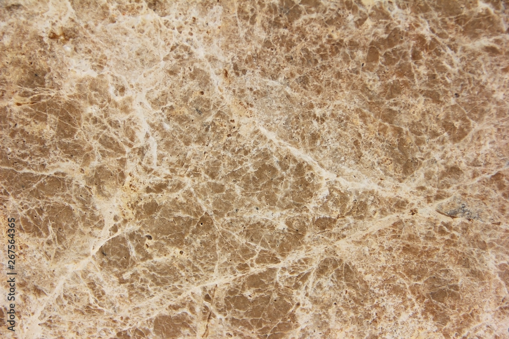 Fototapeta premium brown stone or mwith cracks and patternsarble wall a texture