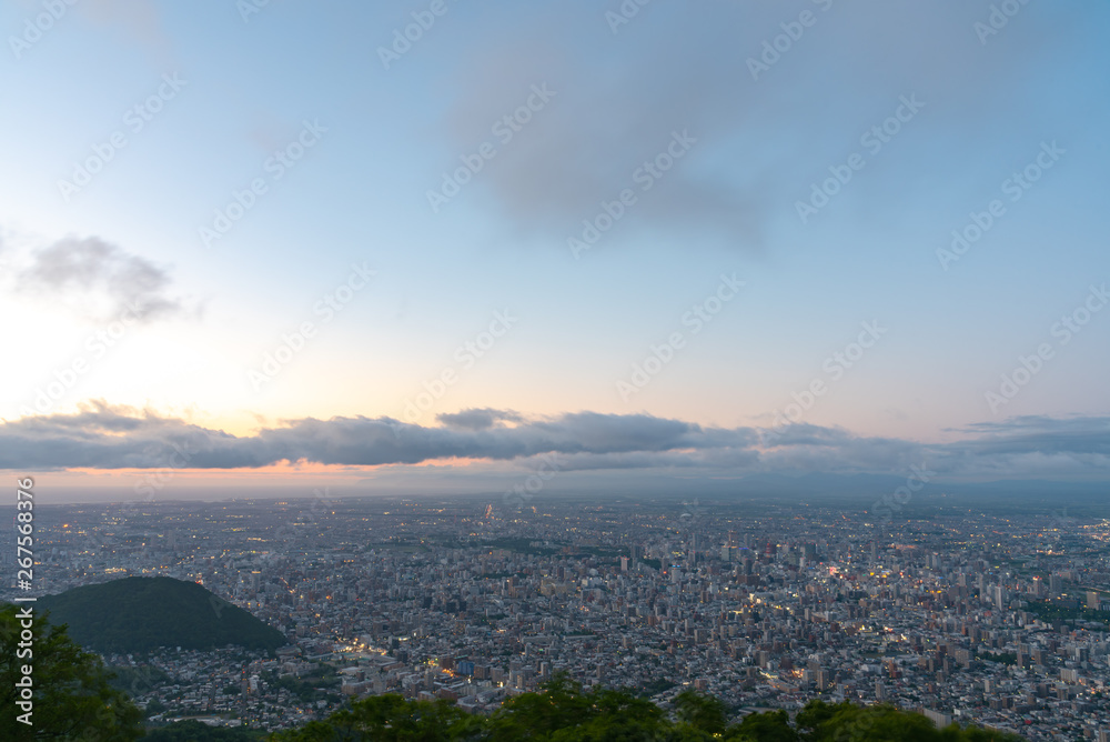 Night cityscape view of Sapporo city from Mountain Moiwa observation. The most popular tourist destinations viewpoint for tourism. Sapporo, Hokkaido, Japan. Night cityscape view of Sapporo city from Mountain Moiwa observation. The most popular tourist destinations viewpoint for tourism. Sapporo, Hokkaido, Japan.