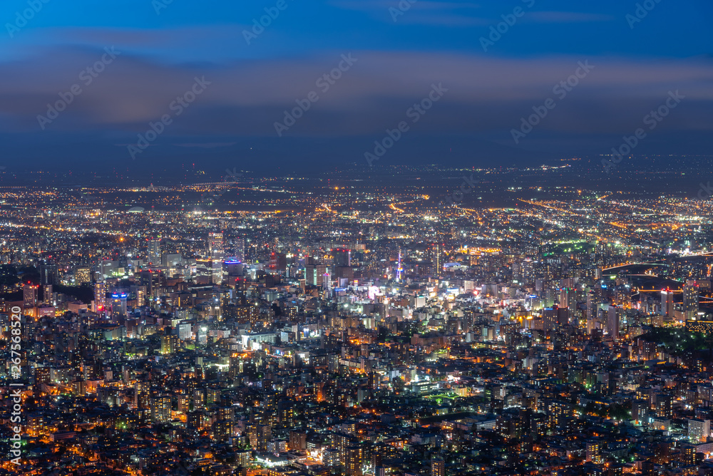 Night cityscape view of Sapporo city from Mountain Moiwa observation. The most popular tourist destinations viewpoint for tourism. Sapporo, Hokkaido, Japan. Night cityscape view of Sapporo city from Mountain Moiwa observation. The most popular tourist destinations viewpoint for tourism. Sapporo, Hokkaido, Japan.