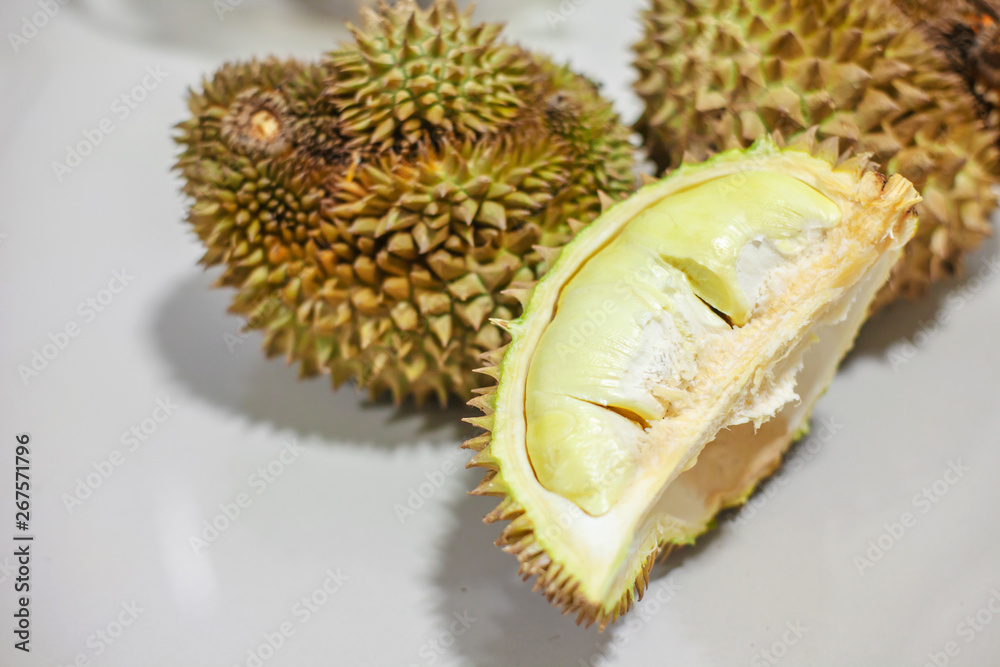 Hand peeling durian shell by knife. The durian is a king of fruit and Recommended Menu in Thailand . Hand peeling durian shell by knife. The durian is a king of fruit and Recommended Menu in Thailand .