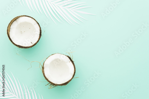 Coconuts with palm leaves on table