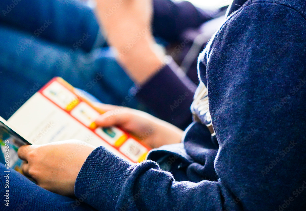 detail of a child reading a book