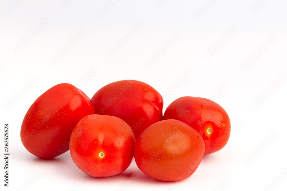 Closeup capture of fresh cherry tomatoes isolated on white background Closeup capture of fresh cherry tomatoes isolated on white background