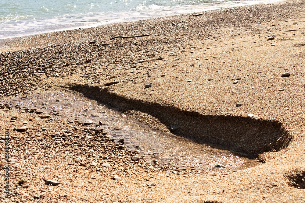A fresh water spring flows from the beach.