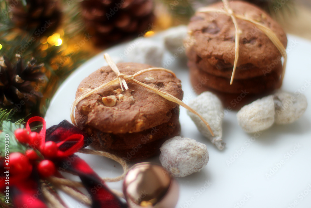 Christmas decorations - oat biscuits for Santa Claus and branches of coniferous trees Christmas decorations - oat biscuits for Santa Claus and branches of coniferous trees