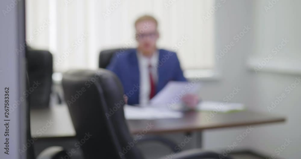 Employee opens door of boss office and chief invites to enter Employee opens door of boss office and chief invites to enter