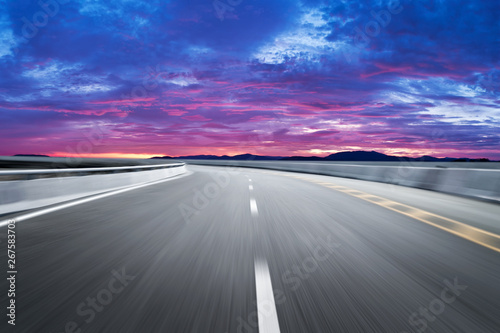 Motion-blurred highway in dusk clouds  © onlyyouqj