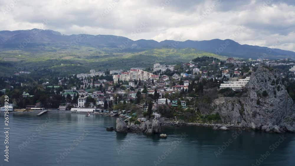 Beautiful aerial sidewards dolly, showcasing the coastline of Meraba on the Crimea. Beautiful aerial sidewards dolly, showcasing the coastline of Meraba on the Crimea.