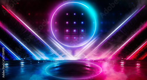 Neon circle, wet asphalt, reflection. Neon circle with the center of a dark empty scene with spotlights. Abstract light. Lights of the night city, abstract light, smog, smoke.