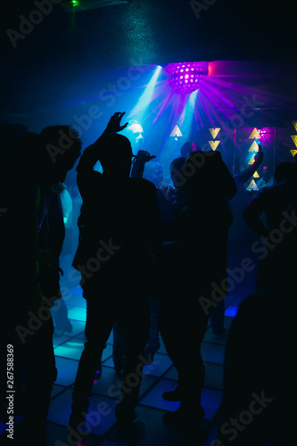 crowd of people dancing in the night club