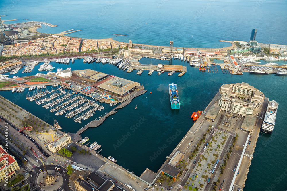 Aerial view of Barcelona Port, marina with boats and seafront Mirador Monument, Spain