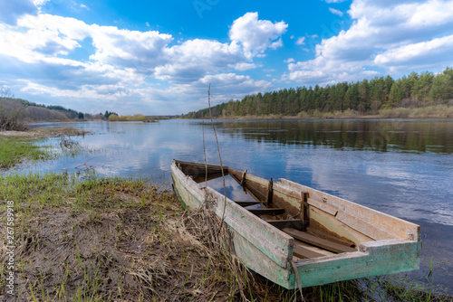 old wooden boat on the lake