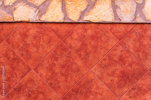 Beautiful old natural stone wall, photo texture and red tile floor tiles