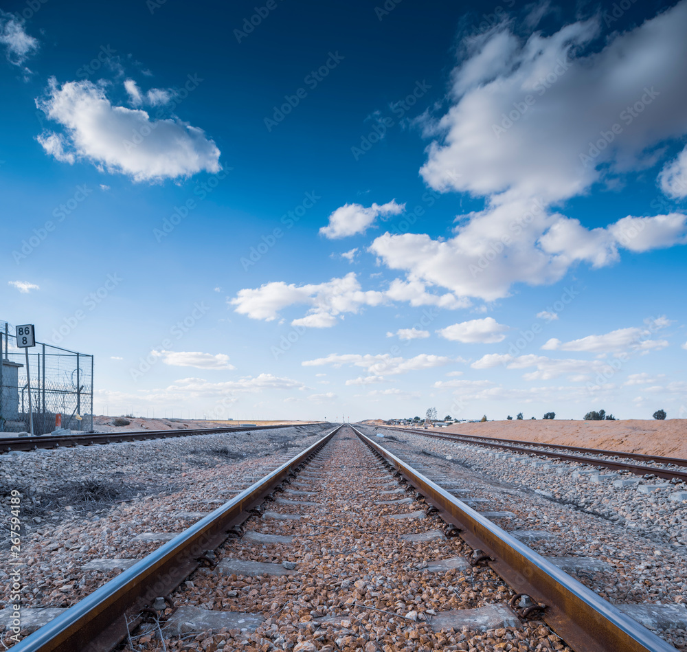 Israel, Nevatim - 5 February 2019: Train tracks in the southern part of Israel Israel, Nevatim - 5 February 2019: Train tracks in the southern part of Israel