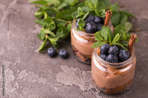 Cake dessert. Chocolate mousse with blueberry, mint and cinnamon