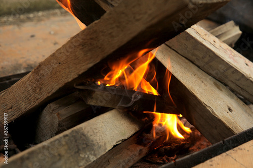 Wood burning in a barbeque grill 