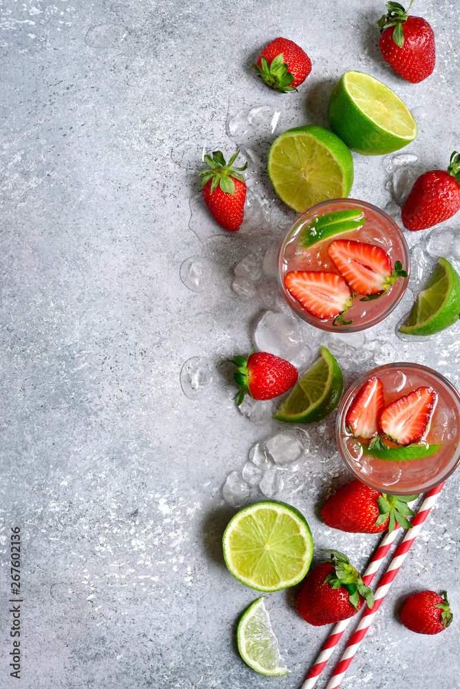 Homemade strawberry lemonade with lime. Top view with copy space. Homemade strawberry lemonade with lime. Top view with copy space.