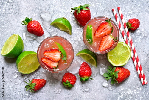 Fototapeta Naklejka Na Ścianę i Meble -  Homemade strawberry lemonade with lime. Top view with copy space.