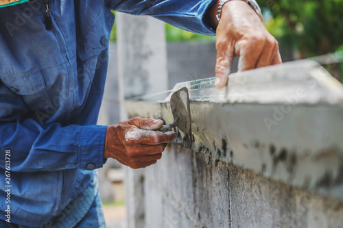 closeup hand of worker are plastering