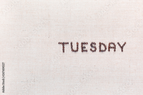 The word Thursday written with coffee beans , aligned to the right.