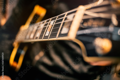 guitar and music string macro detail focus zone studio recording play hand concert closeup art guitarust rock electric color contrast melody harmony rhythm magic creation craft wood composer chord  photo