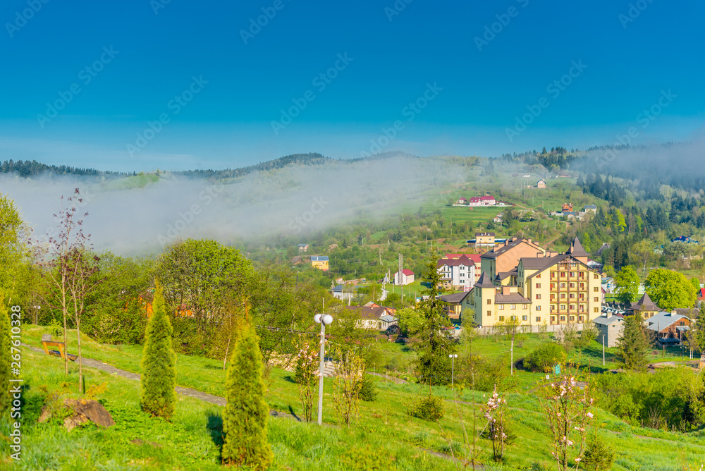 Colorful  Ukrainian village on the mountain hills in the morning