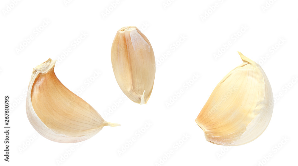 Pieces of broken garlic isolated on white background with clipping path.