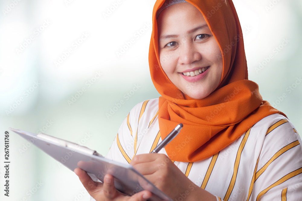 Muslim Woman Writing Something Muslim Woman Writing Something