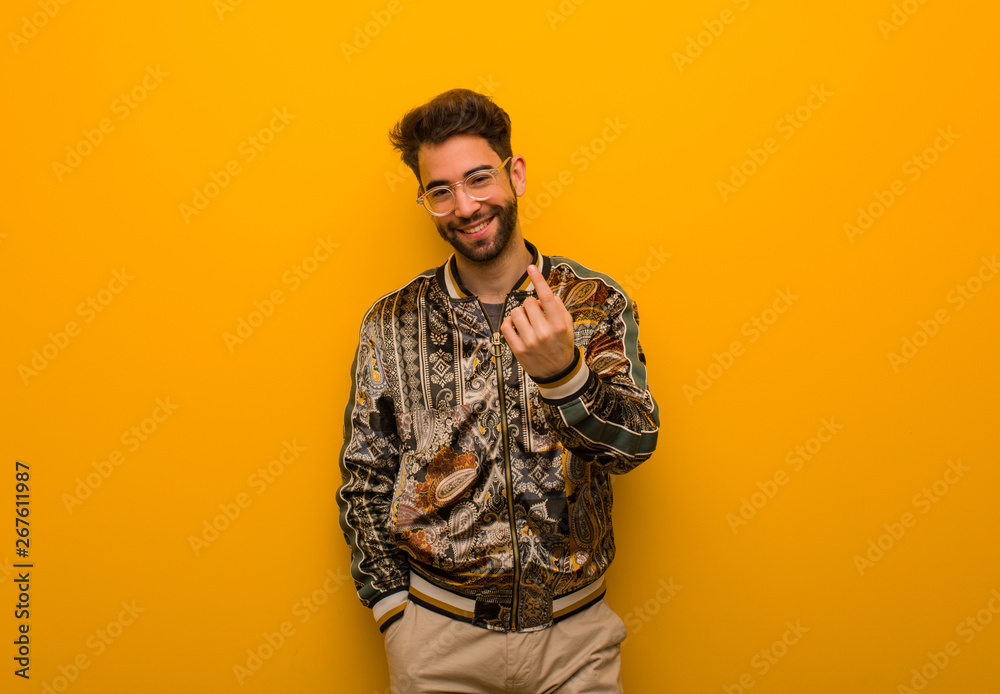 Young cool man inviting to come Young cool man inviting to come