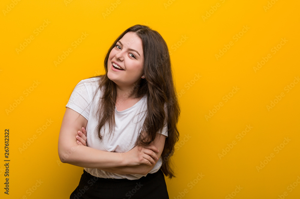 Obraz premium Young curvy plus size woman laughing and having fun.