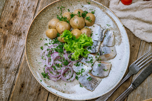 Herring with potatoes on plate