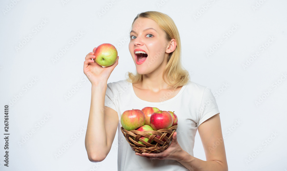 Enjoying healthy eating. vitamin diet and food shooping. farming concept. healthy teeth. autumn harvest. Spring seasonal fruit. Happy woman eating apple. orchard, gardener girl with apple basket Enjoying healthy eating. vitamin diet and food shooping. farming concept. healthy teeth. autumn harvest. Spring seasonal fruit. Happy woman eating apple. orchard, gardener girl with apple basket