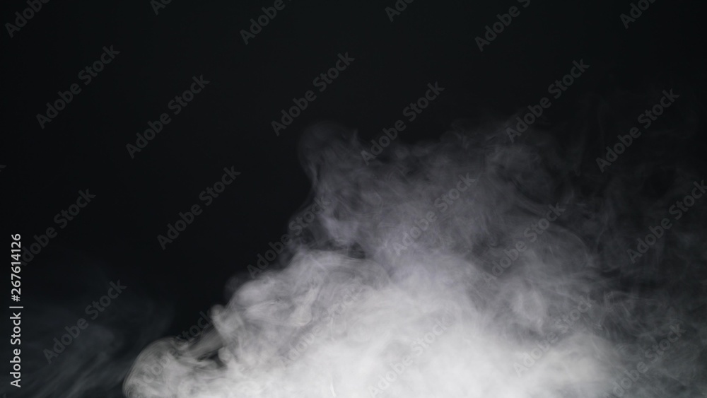 Fototapeta premium White exploding powder over black background