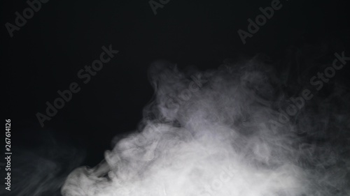 White exploding powder over black background