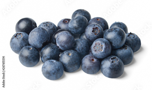 A small pile of fresh juicy blueberries isolated on white. Side view.