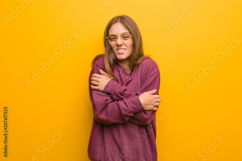 Young casual woman going cold due to low temperature © Asier