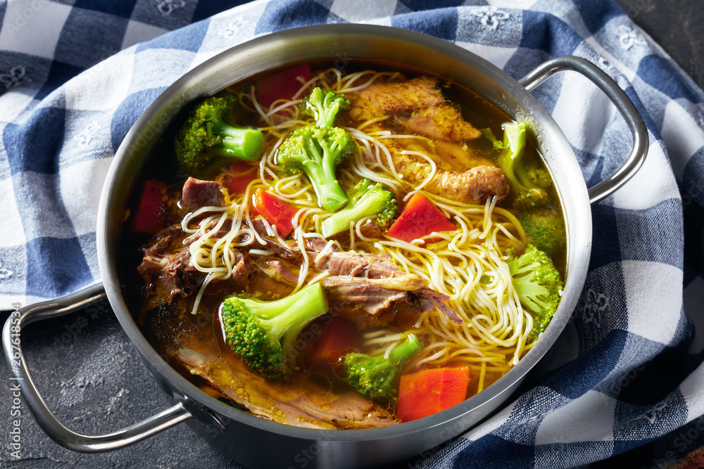 chicken noodle soup with broccoli, carrots, spices chicken noodle soup with broccoli, carrots, spices