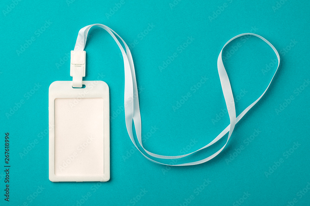 Blank ID card / badge with a white zone on a blue background. Place for text. Blank ID card / badge with a white zone on a blue background. Place for text.