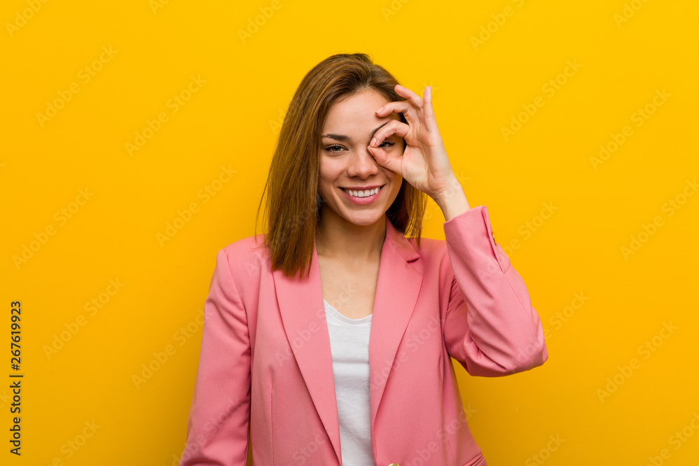 Young fashion business woman excited keeping ok gesture on eye. Young fashion business woman excited keeping ok gesture on eye.
