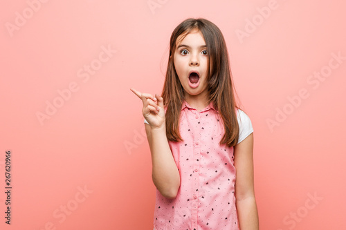 Принти на полотні Cute little girl pointing to the side