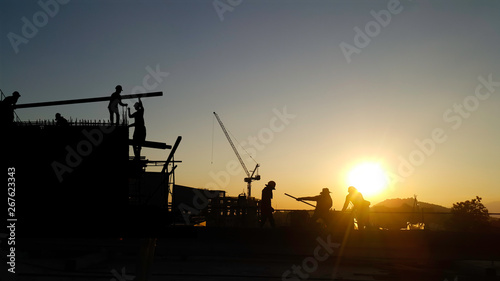 Silhouette construction workers